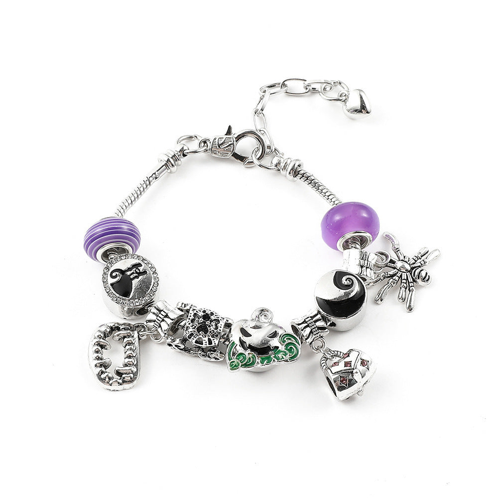 Combo bracelet featuring pumpkin, spider, bat, and ghost charms