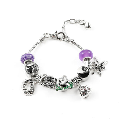 Combo bracelet featuring pumpkin, spider, bat, and ghost charms