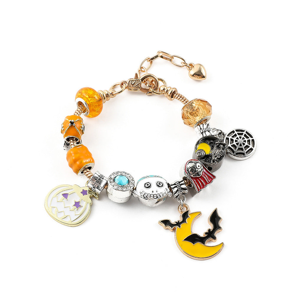 Combo bracelet featuring pumpkin, spider, bat, and ghost charms